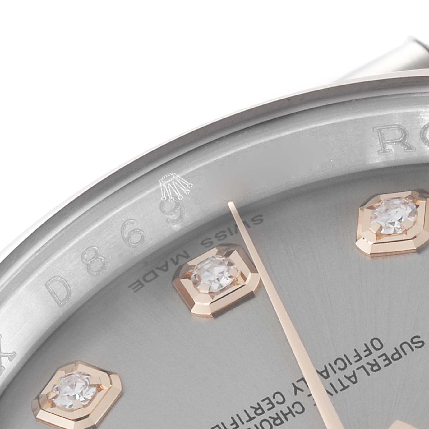 This close-up image shows the dial and part of the bezel of the Rolex Datejust 116201 Men's Steel and Gold (two tone) Silver Dial 116201 Men's Steel and Gold (two tone) Silver Dial, featuring diamond hour markers.