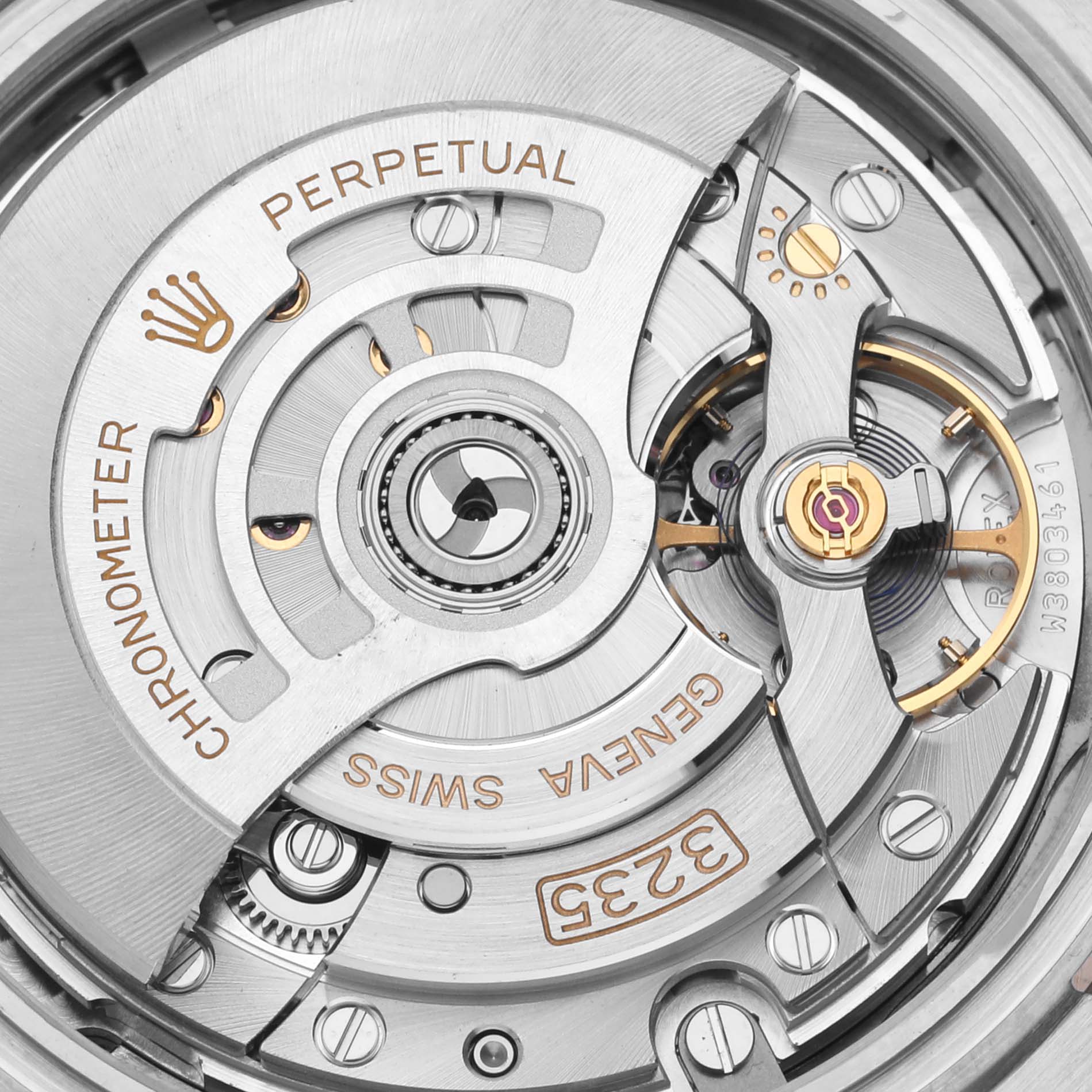 The image shows the Rolex Datejust 41 126331 Men's Steel and Gold (two tone) Grey Dial 126331 Men's Steel and Gold (two tone) Grey Dial's movement, highlighting its intricate components from a close-up view.