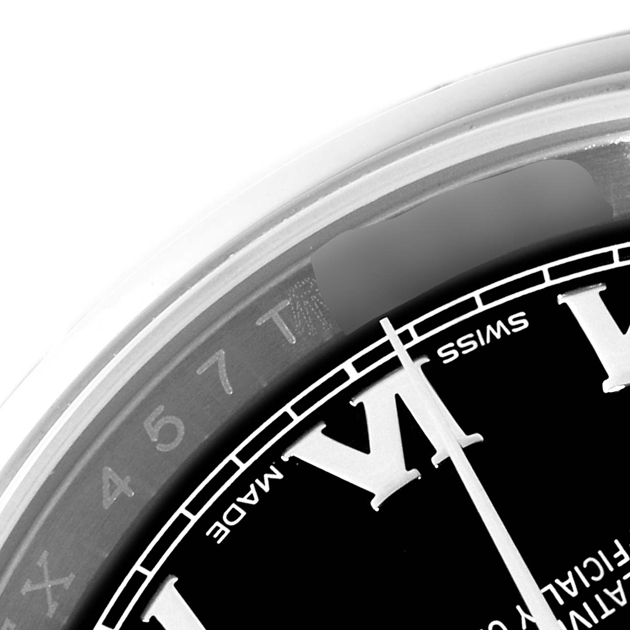 This is a close-up of the Rolex Datejust 116200 Men's Stainless Steel Black Dial 116200 Men's Stainless Steel Black Dial model, showing the chapter ring, edge of the dial, and part of the Roman numeral markers.