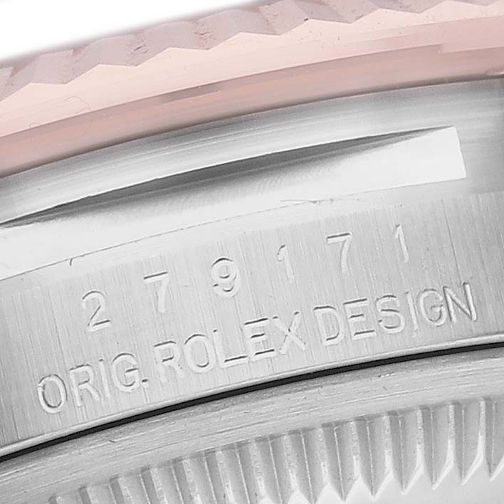 The image shows a close-up of the serial number and engraved text on the case edge of a Rolex Datejust 279171 Women's Steel and Gold (two tone) Brown Dial 279171 Women's Steel and Gold (two tone) Brown Dial watch.
