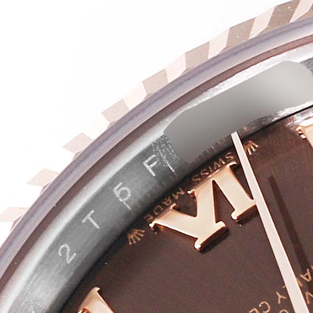 The image shows a close-up of the bezel, the minute hand, and part of the dial of a Rolex Datejust 279171 Women's Steel and Gold (two tone) Brown Dial 279171 Women's Steel and Gold (two tone) Brown Dial watch.