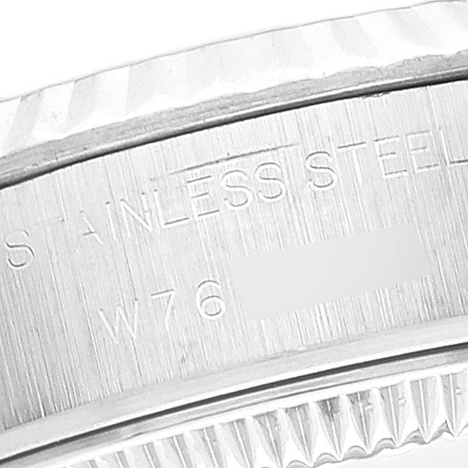 The image shows a close-up of the side of the bezel and part of the case back of a Rolex Datejust 69174 Women's Stainless Steel Silver Dial 69174 Women's Stainless Steel Silver Dial, with engraving visible.