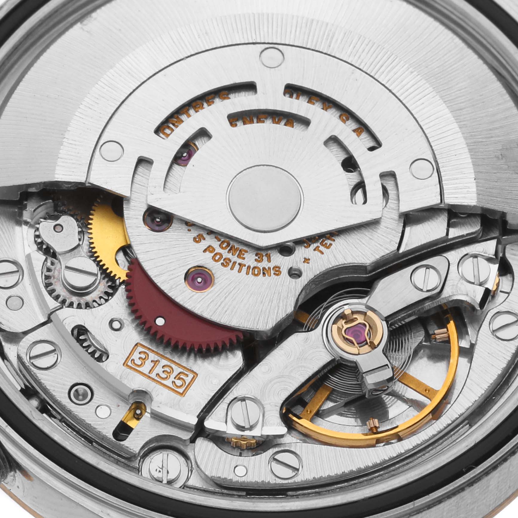 The image shows the intricate internal movement of a Rolex Datejust 16233 Men's Steel and Gold (two tone) Black Dial 16233 Men's Steel and Gold (two tone) Black Dial watch from a close-up angle, highlighting gears and mechanisms.