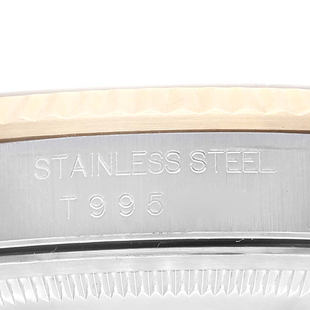 The image shows a close-up of the side of the case of a Rolex Datejust 16233 Men's Steel and Gold (two tone) Champagne Dial 16233 Men's Steel and Gold (two tone) Champagne Dial watch, highlighting the stainless steel material and part of the bezel.