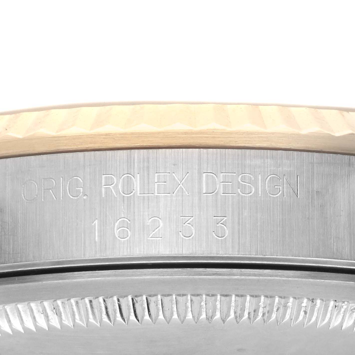 The image shows the side view of the Rolex Datejust 16233 Men's Steel and Gold (two tone) Champagne Dial 16233 Men's Steel and Gold (two tone) Champagne Dial, highlighting the engraved bezel and model number.