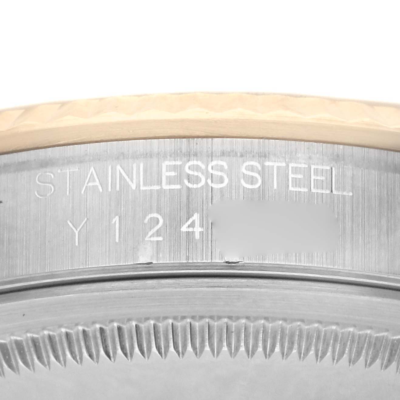 The image shows a close-up of the side of the Rolex Datejust 16233 Men's Steel and Gold (two tone) Champagne Dial 16233 Men's Steel and Gold (two tone) Champagne Dial case, displaying the stainless steel engraving.