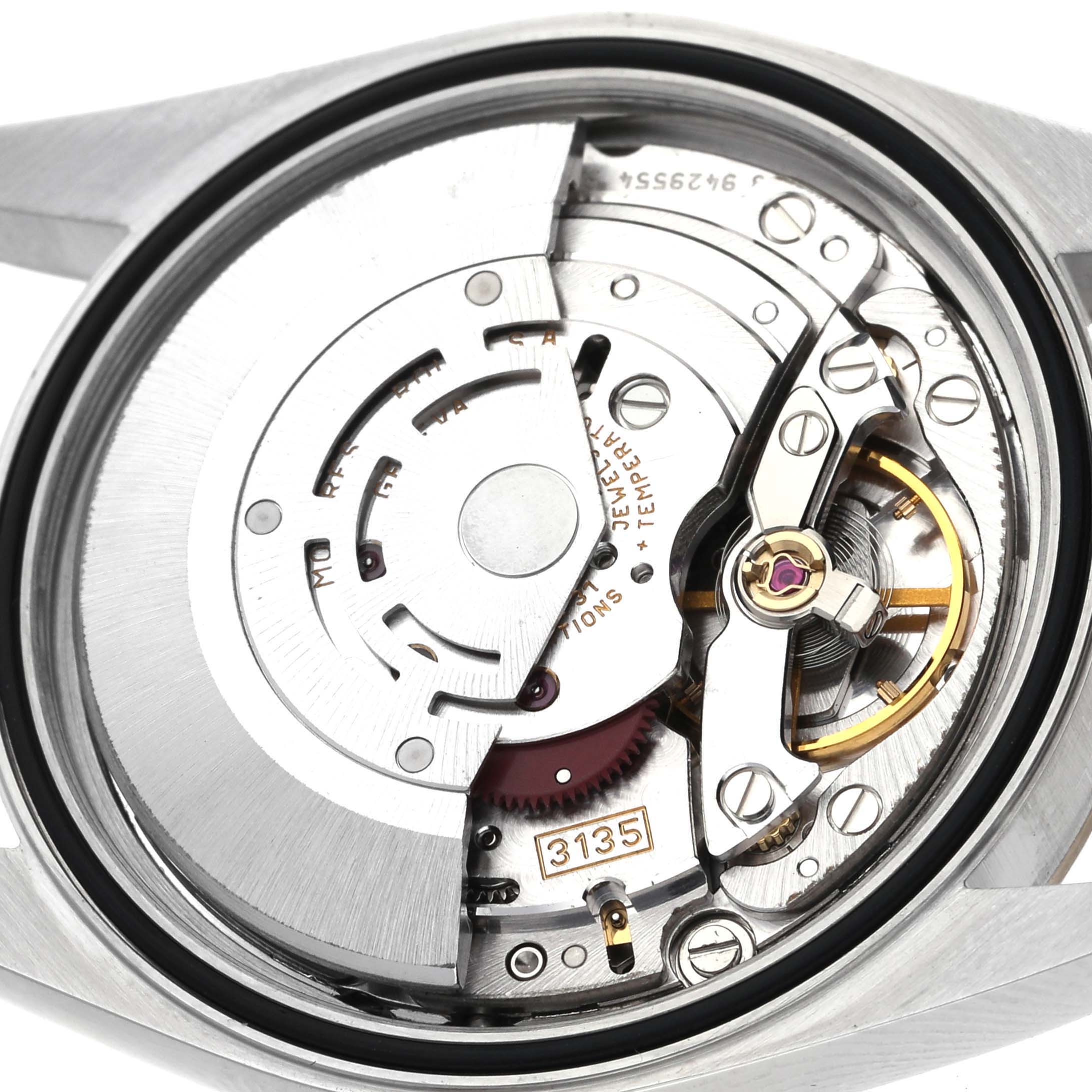 The image shows the movement mechanism of a Rolex Datejust 16233 Men's Steel and Gold (two tone) Champagne Dial 16233 Men's Steel and Gold (two tone) Champagne Dial watch from a close-up back view.