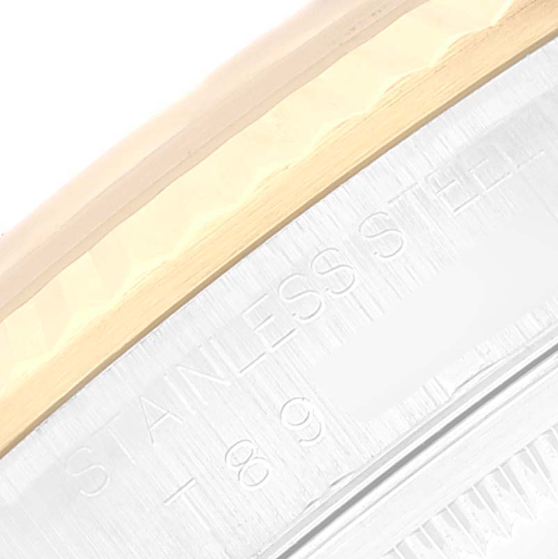 This is a close-up angle showing the stainless steel and gold edge of the Rolex Datejust 16233 Men's Steel and Gold (two tone) Silver Dial 16233 Men's Steel and Gold (two tone) Silver Dial model.