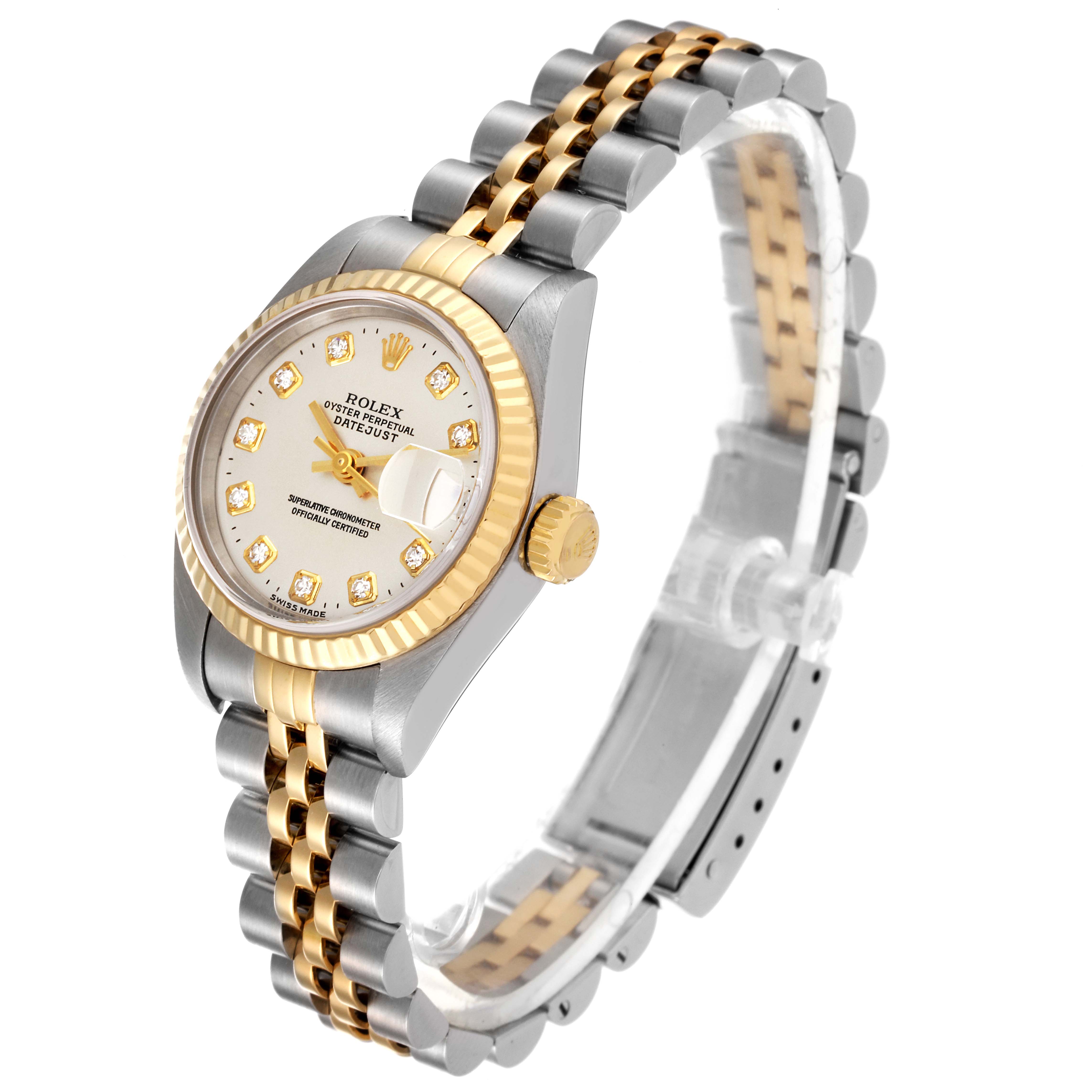 This Rolex Datejust 79173 Women's Steel and Gold (two tone) Silver Dial 79173 Women's Steel and Gold (two tone) Silver Dial watch is shown at an angle highlighting its gold and silver bracelet, bezel, crown, and diamond-studded dial.