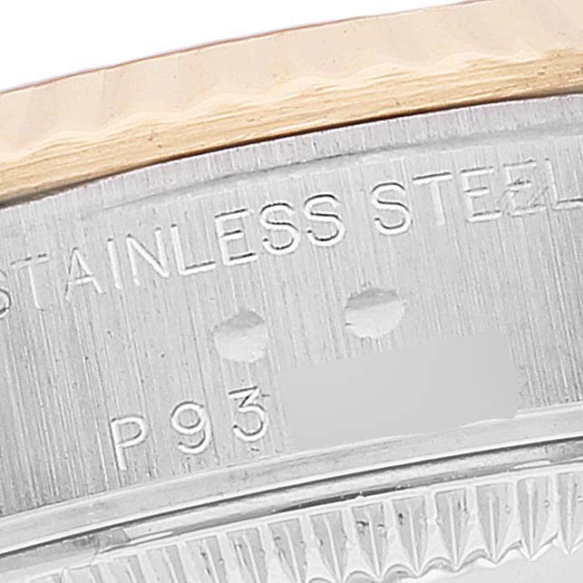 This close-up shows the side and bezel of a Rolex Datejust 79173 Women's Steel and Gold (two tone) Silver Dial 79173 Women's Steel and Gold (two tone) Silver Dial watch, focusing on the stainless steel engraving.