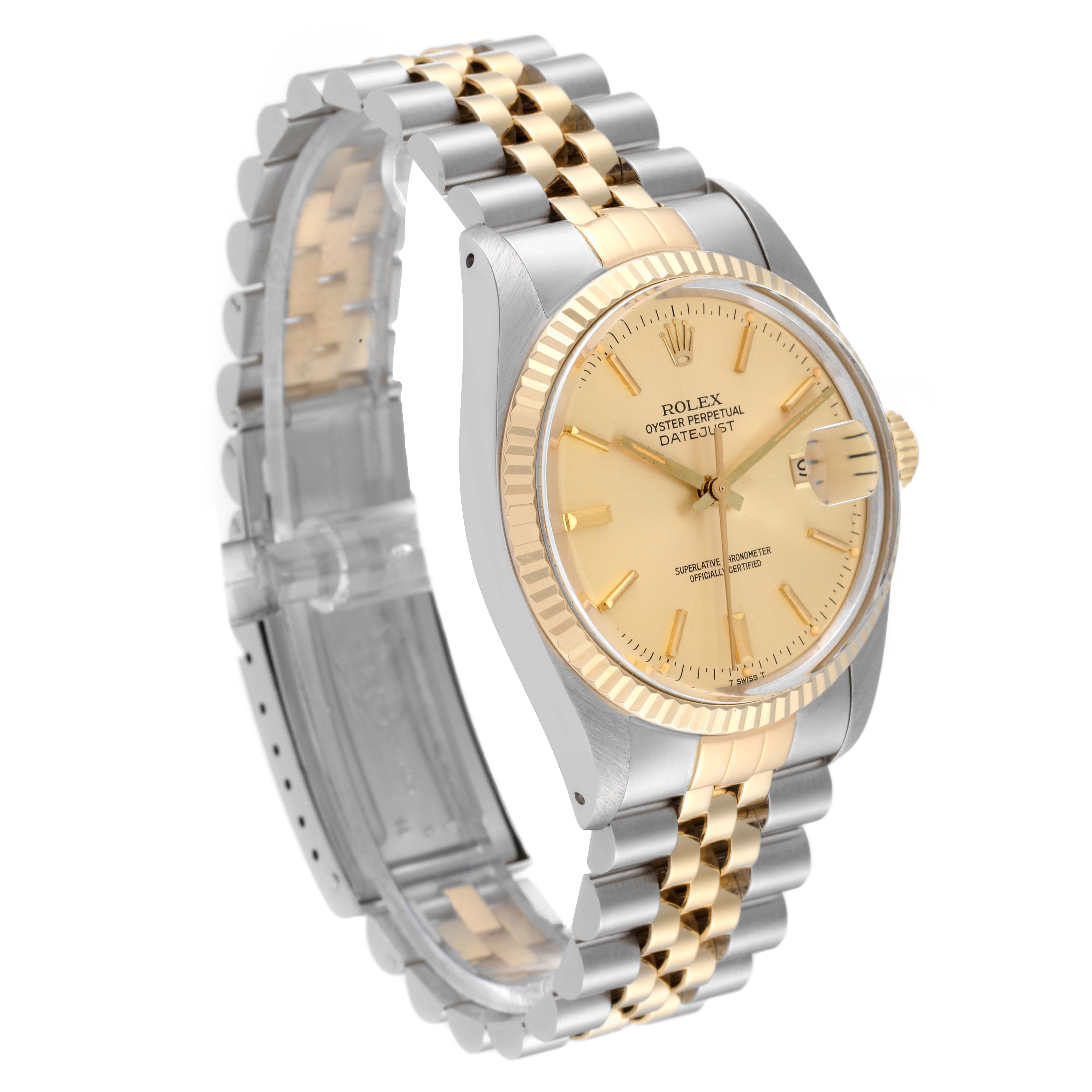 The image shows a Vintage Collection Rolex watch featuring its gold dial, two-tone bracelet, and fluted bezel at a slight angle.