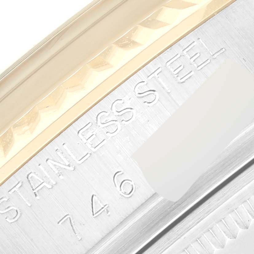 The image shows a close-up of the edge with "Stainless Steel" engraving on the case of a Vintage Collection model by Rolex.