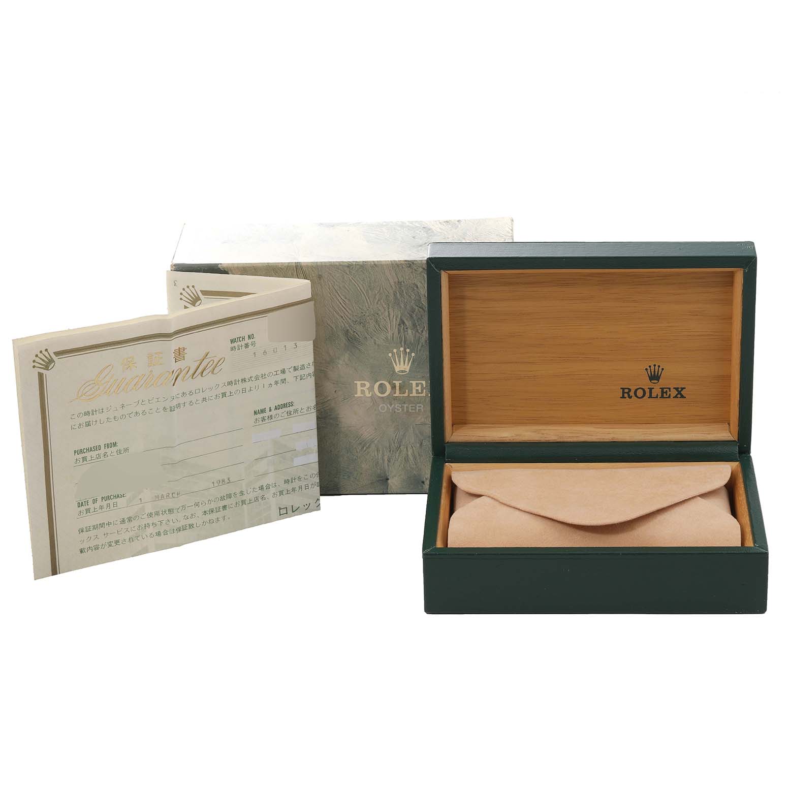 The image shows the open packaging box with a cushioned pillow and a guarantee booklet for a Rolex Vintage Collection 16013 Men's Steel and Gold (two tone) Champagne Dial 16013 Men's Steel and Gold (two tone) Champagne Dial watch.
