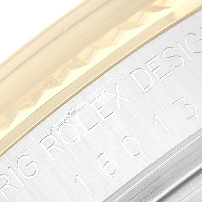 This is a close-up view of the engraved side case of the Rolex Vintage Collection 16013 Men's Steel and Gold (two tone) Champagne Dial 16013 Men's Steel and Gold (two tone) Champagne Dial model 16013.