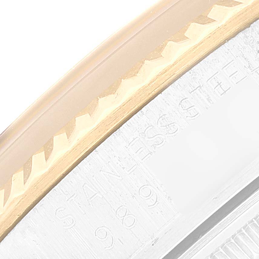 This close-up image shows the bezel and part of the engraved casing of the Vintage Collection model by Rolex.