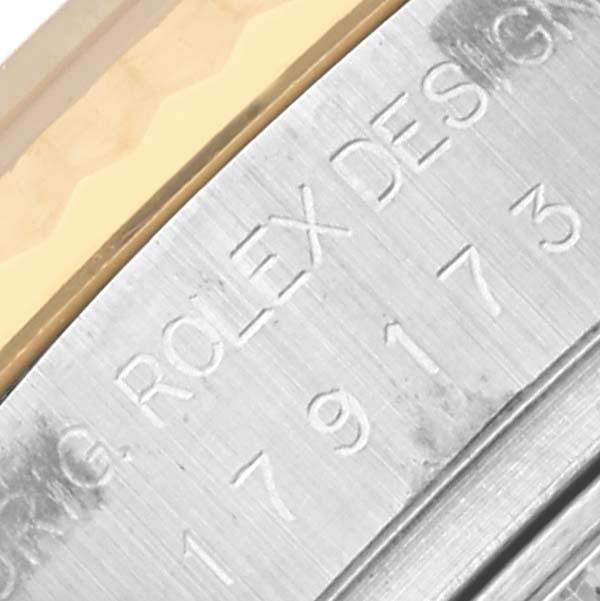 The image shows the engraved side of the Rolex Datejust 179173 Women's Steel and Gold (two tone) White Dial 179173 Women's Steel and Gold (two tone) White Dial, highlighting the serial and model numbers.