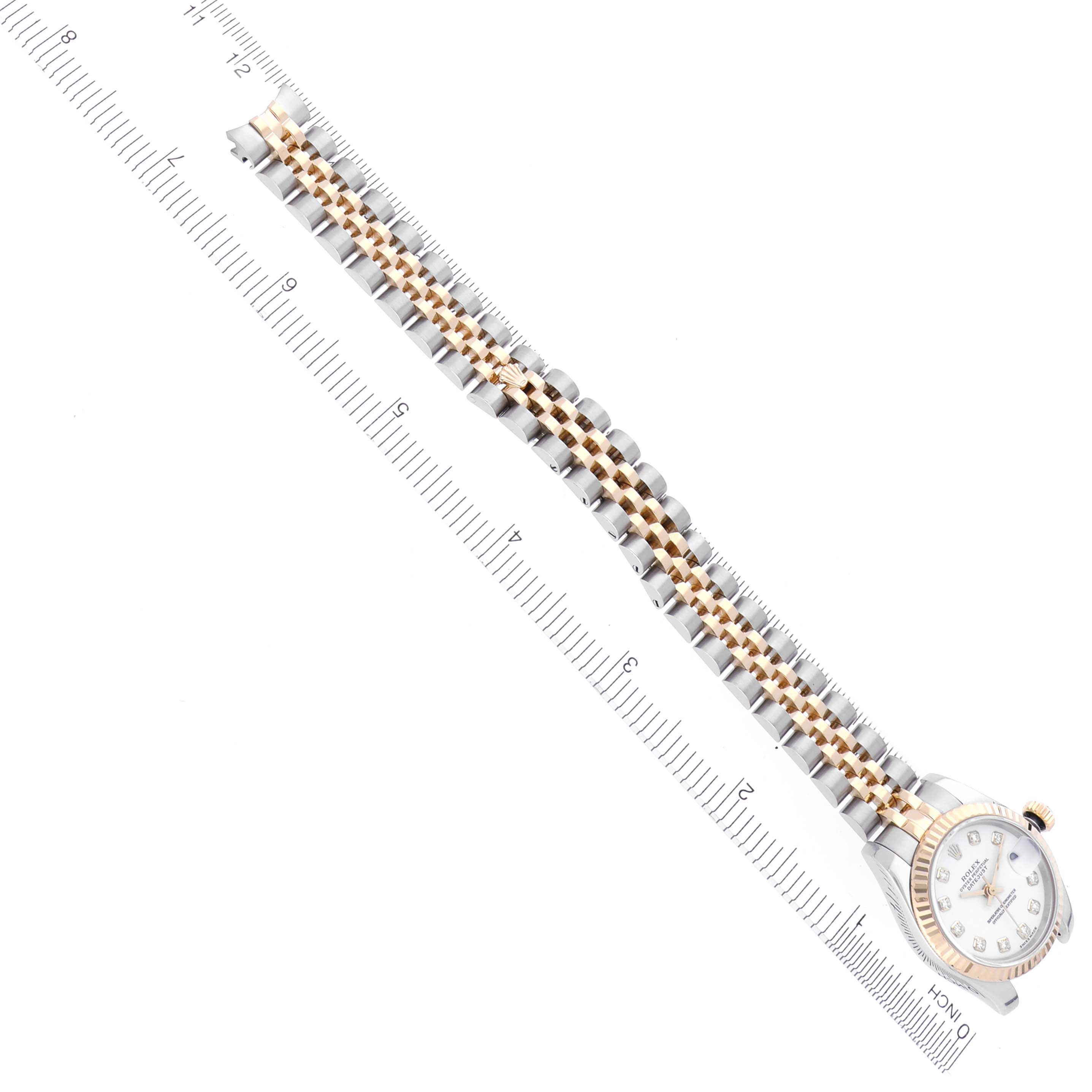 The image shows a Rolex Datejust 179173 Women's Steel and Gold (two tone) White Dial 179173 Women's Steel and Gold (two tone) White Dial watch from an angled top view, highlighting the face, bezel, and full bracelet.