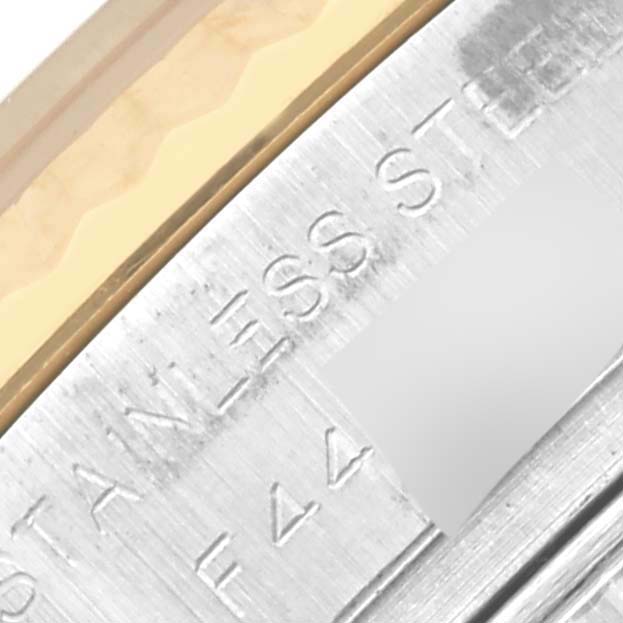 The image shows a close-up angle of the side casing of a Rolex Datejust 179173 Women's Steel and Gold (two tone) White Dial 179173 Women's Steel and Gold (two tone) White Dial watch, highlighting the engraved "STAINLESS STEEL" text.