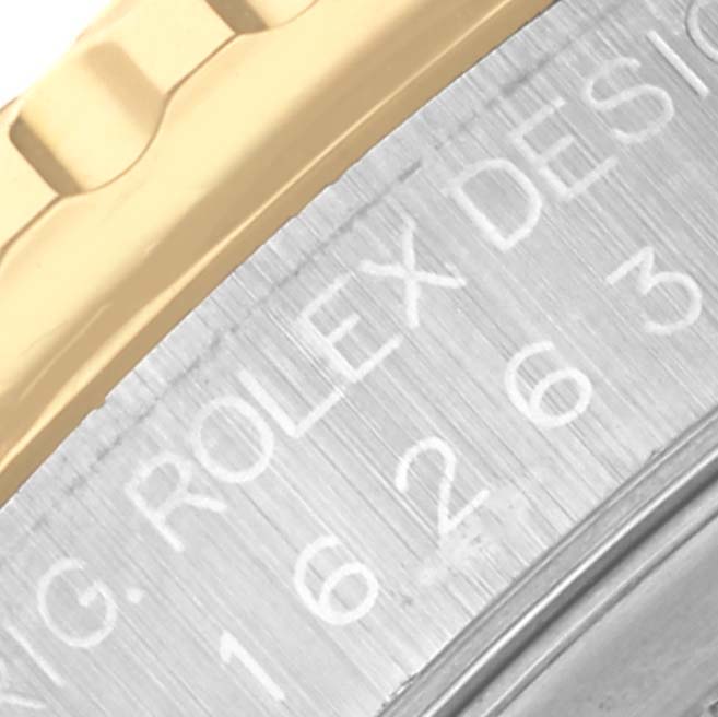 The image shows a close-up of the bezel and engraved side of a Rolex Turn-o-Graph 16263 Men's Steel and Gold (two tone) White Dial 16263 Men's Steel and Gold (two tone) White Dial watch.