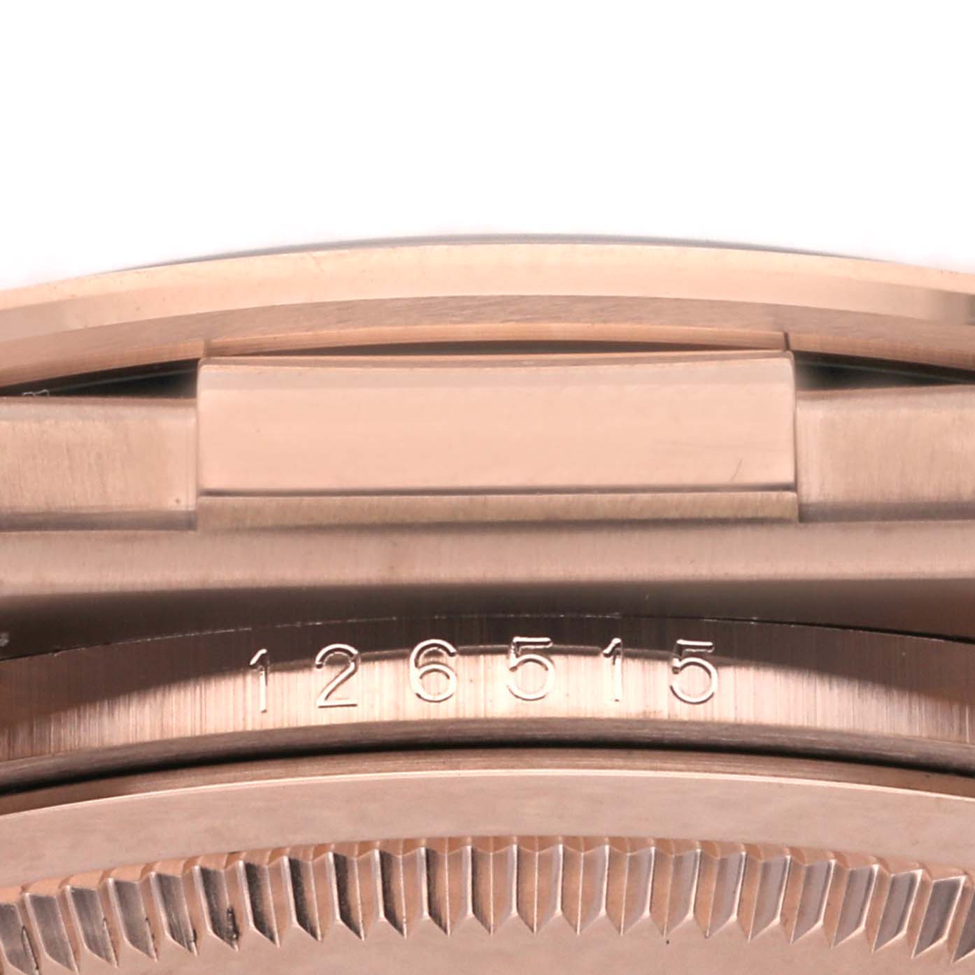 The image shows the side view of the Rolex Daytona 126515 Men's Rose Gold Black Dial 126515 Men's Rose Gold Black Dial model, focusing on the clasp and partial bracelet.