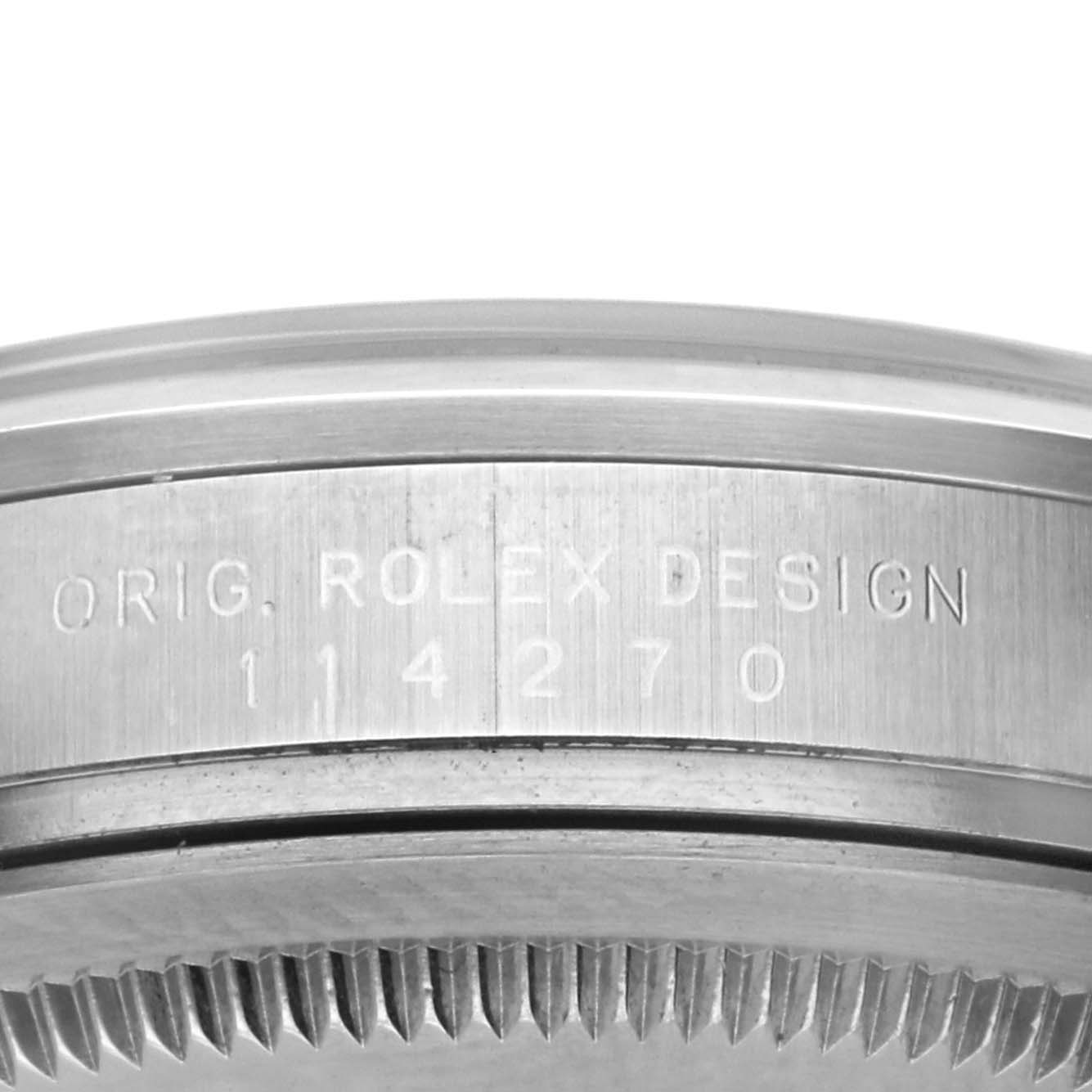 The image shows the side view of a Rolex Explorer 114270 Men's Stainless Steel Black Dial 114270 Men's Stainless Steel Black Dial, highlighting the engraved case and bezel edge.