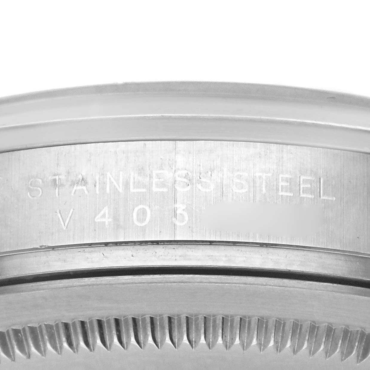 The image shows an angled view of the case side and bezel edge of the Rolex Explorer 114270 Men's Stainless Steel Black Dial 114270 Men's Stainless Steel Black Dial, highlighting the "STAINLESS STEEL" engraving.