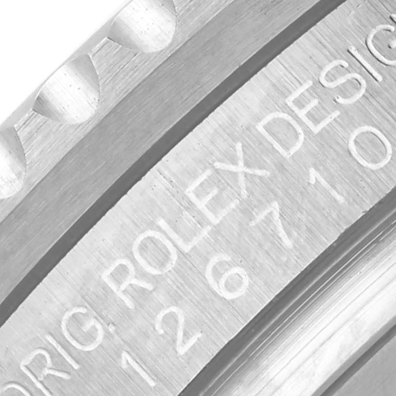 The image shows a close-up of the case back of a Rolex GMT-Master 126710BLNR Men
s Stainless Steel Black Dial 126710BLNR Men
s Stainless Steel Black Dial, highlighting the branding and model number.