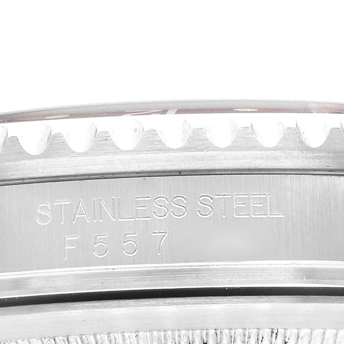 This image shows a close-up of the side of a Rolex GMT-Master 16710 Men
s Stainless Steel Black Dial 16710 Men
s Stainless Steel Black Dial watch, showcasing the stainless steel marking and part of the bezel.