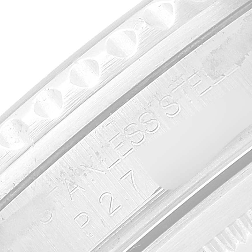 The image shows a close-up of the side of the bezel and case of a Rolex GMT-Master 16710 Men
s Stainless Steel Black Dial 16710 Men
s Stainless Steel Black Dial watch, highlighting the stainless steel material.