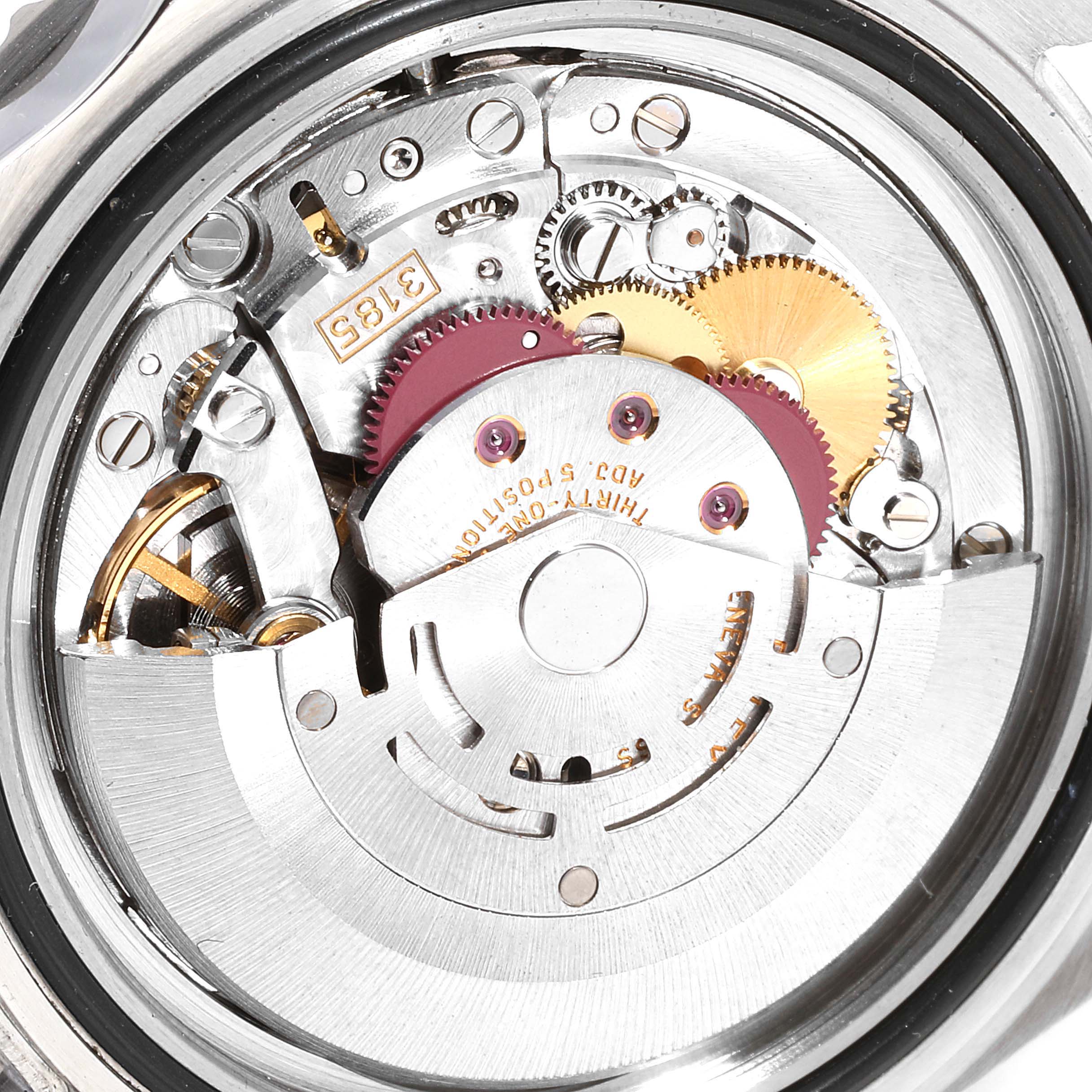 The image shows the internal mechanism of a Rolex GMT-Master 16710 Men's Stainless Steel Black Dial 16710 Men's Stainless Steel Black Dial watch, highlighting gears and the movement components from the back.