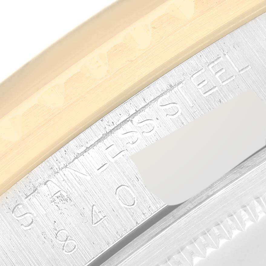 This image shows a close-up of the side of the Rolex Vintage Collection 16753 Men's Stainless Steel Brown Dial 16753 Men's Stainless Steel Brown Dial watch, featuring the stainless steel engraving.