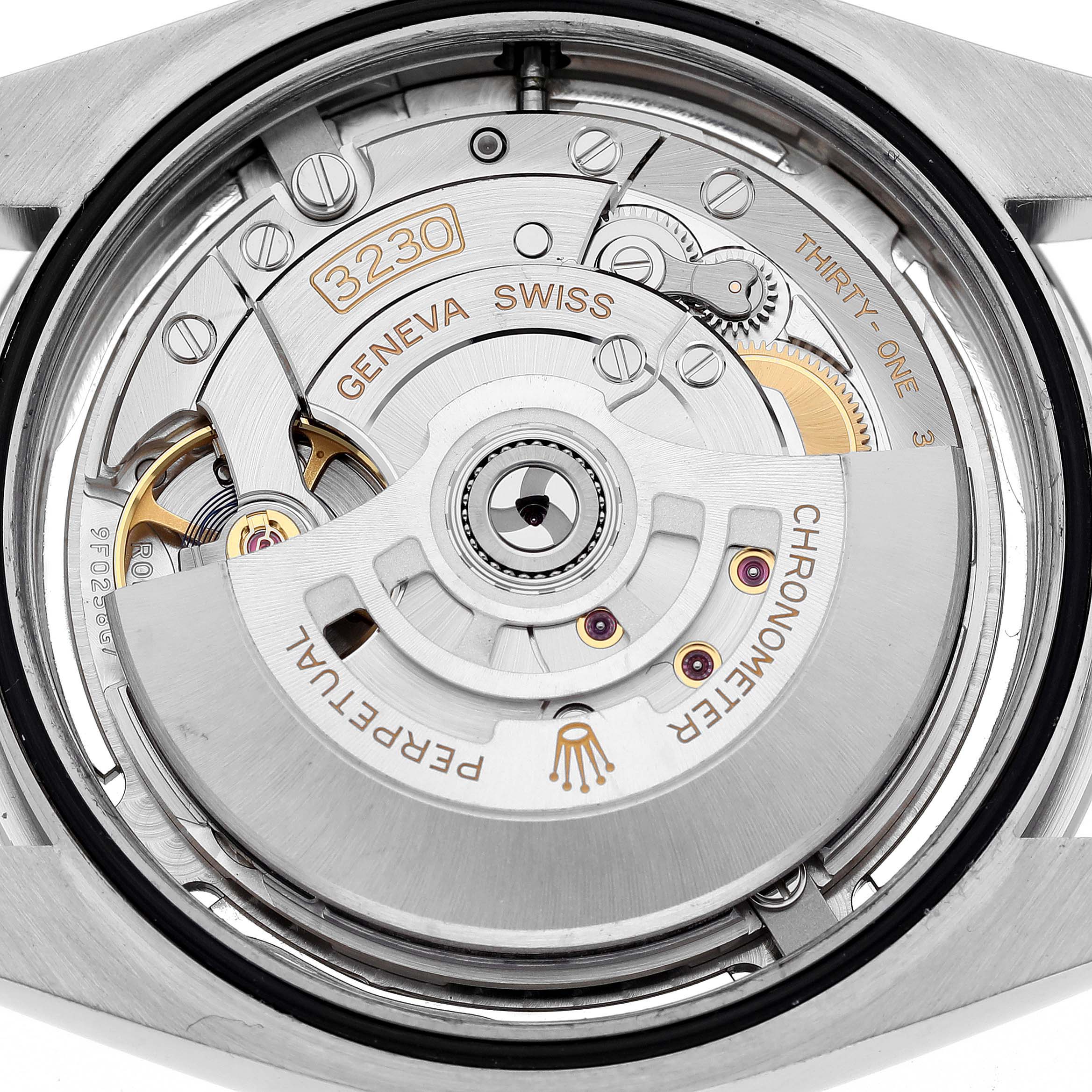 The image shows the movement and internal mechanism of a Rolex Oyster Perpetual 124300 Men
s Stainless Steel Silver Dial 124300 Men
s Stainless Steel Silver Dial watch from a back angle.