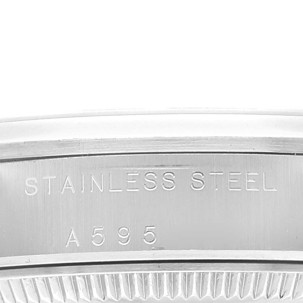 This close-up image shows the side of the stainless steel case back on a Mid-Size Rolex watch.