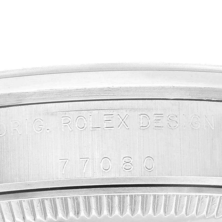 This close-up image shows the engraved model number and design marking on the side of a Mid-Size Rolex watch.