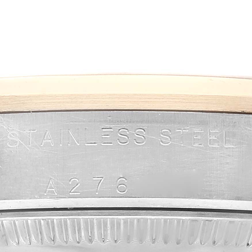 This image shows a close-up view of the side of a Mid-Size Rolex watch with "STAINLESS STEEL" and "A276" engraved.