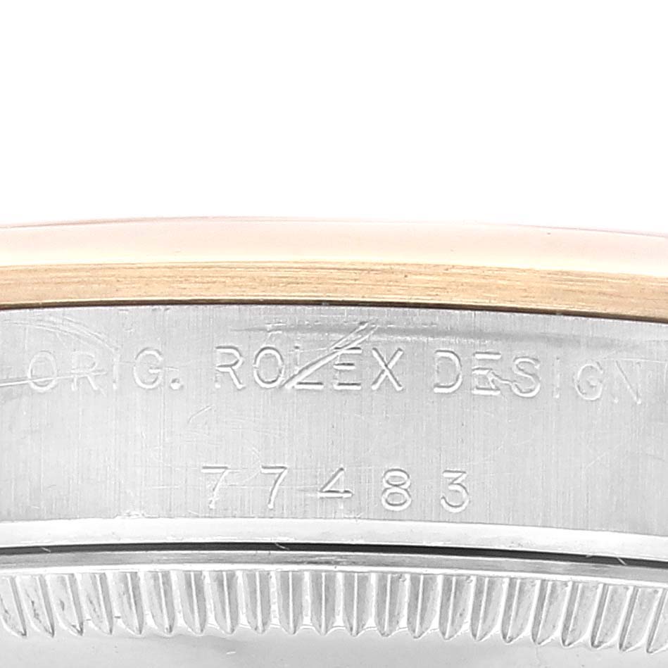 This close-up image shows the side case and model number engraving of a Mid-Size Rolex watch.
