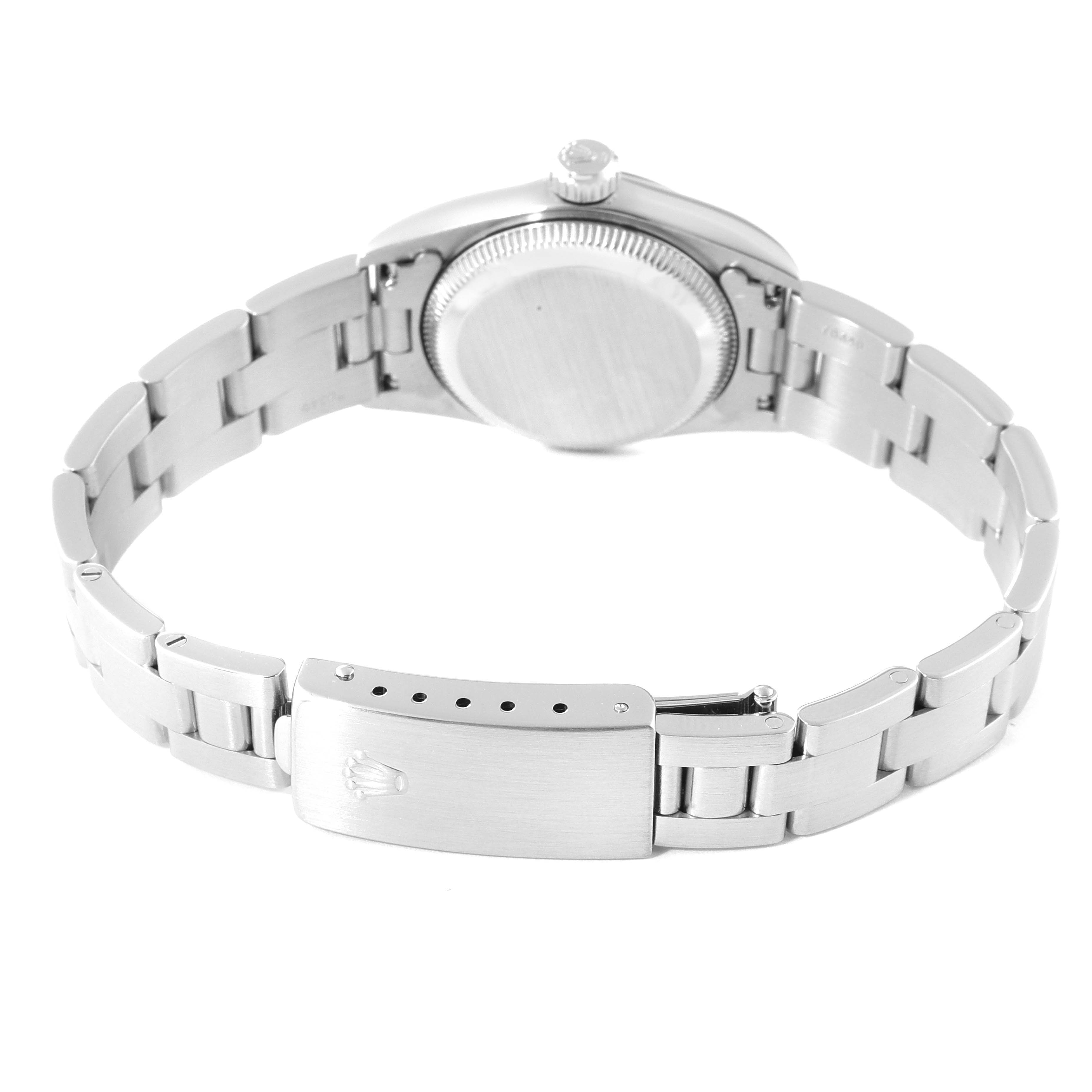 This image shows the back case and bracelet clasp of the Rolex Oyster Perpetual 67180 Women
s Stainless Steel Pink Dial 67180 Women
s Stainless Steel Pink Dial watch from a bottom angle.