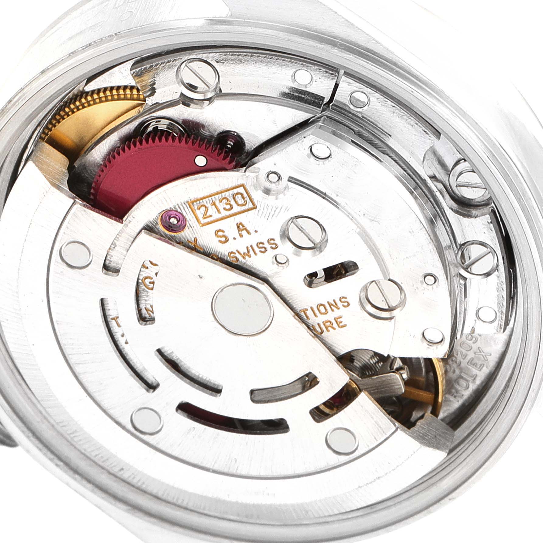 The image shows a close-up of the movement mechanism of the Rolex Oyster Perpetual 67180 Women
s Stainless Steel Pink Dial 67180 Women
s Stainless Steel Pink Dial watch, highlighting its intricate parts.