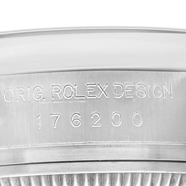 This is a close-up view of the side of the case of a Rolex Oyster Perpetual 176200 Women's Stainless Steel Silver Dial 176200 Women's Stainless Steel Silver Dial watch, showing the engraved model number 176200.