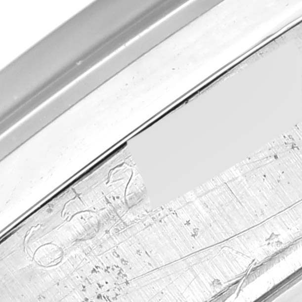 The image shows a close-up of the side case and serial number engraving of a Rolex Vintage Collection 6694 Men
s Stainless Steel Grey Dial 6694 Men
s Stainless Steel Grey Dial model.