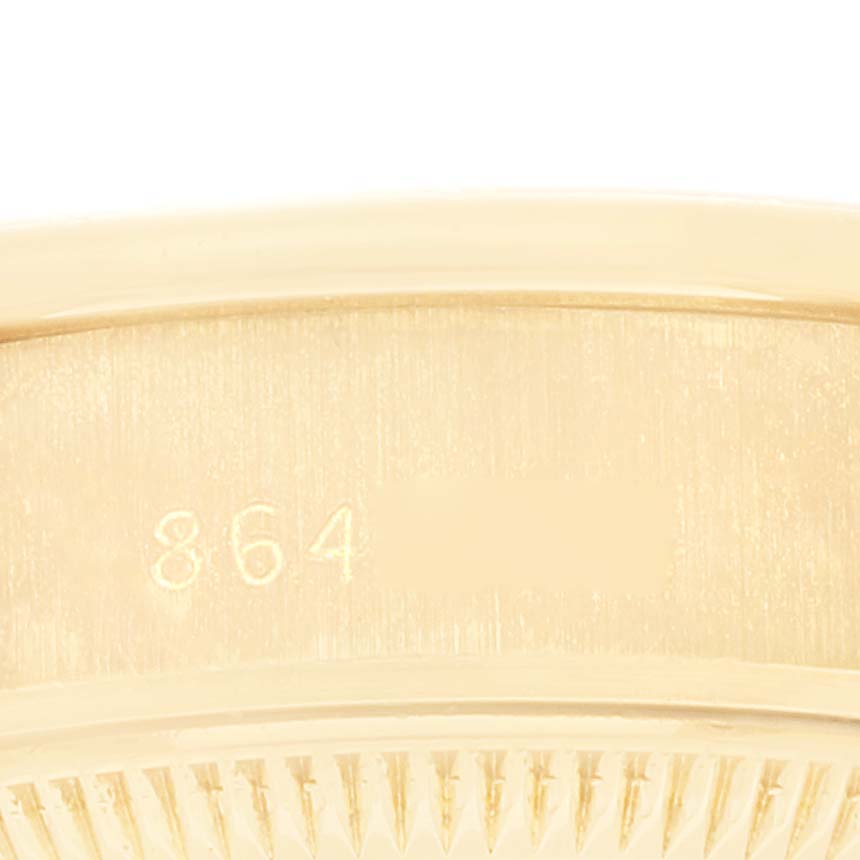 This zoomed-in image of the President model by Rolex shows part of the watch
s case with engraved numbers.