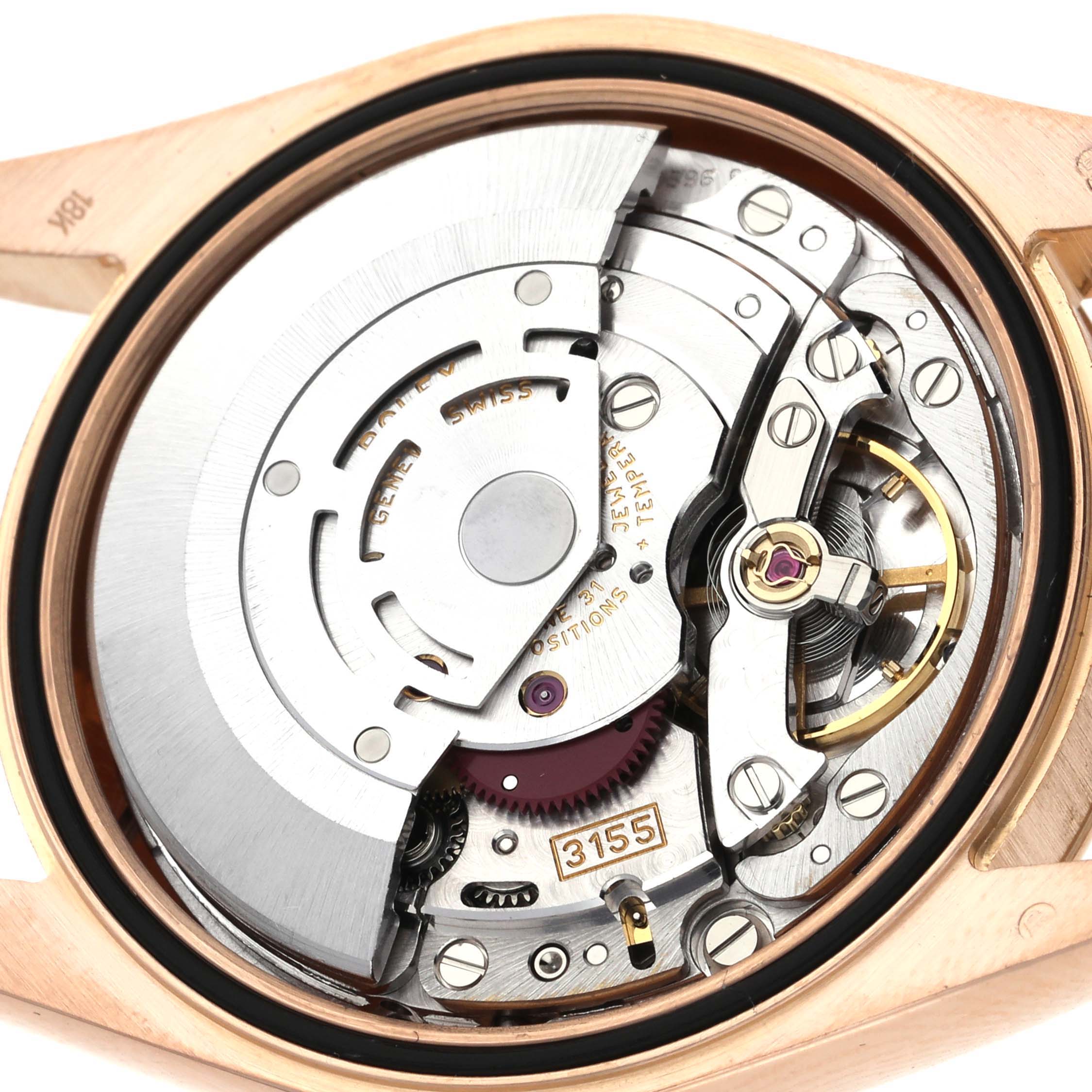 The image shows the intricate inner mechanism of a Rolex President 118235 Men's Rose Gold Pink Dial 118235 Men's Rose Gold Pink Dial model from a back angle.