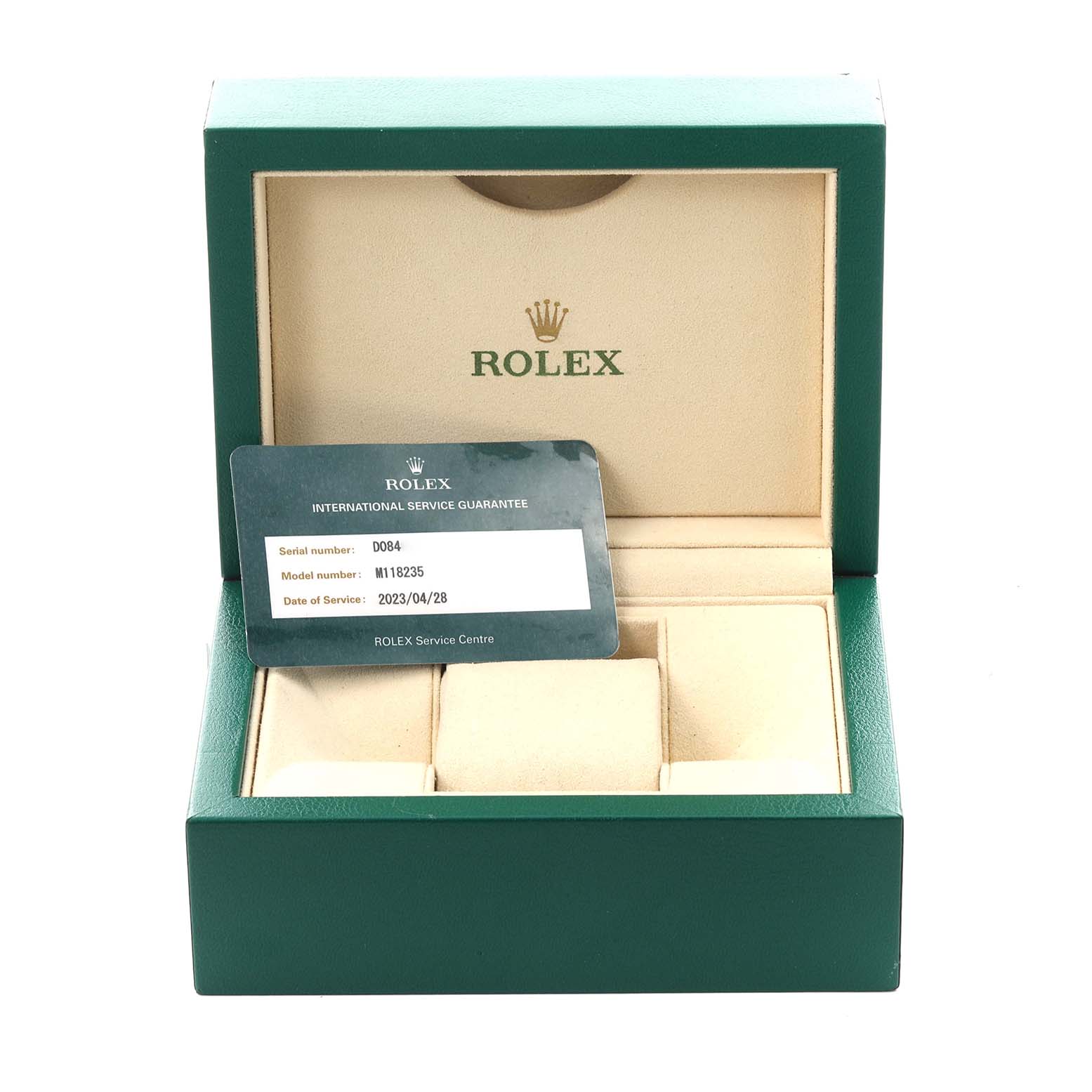The image shows an open green Rolex box for the President model, displaying a service guarantee card inside.