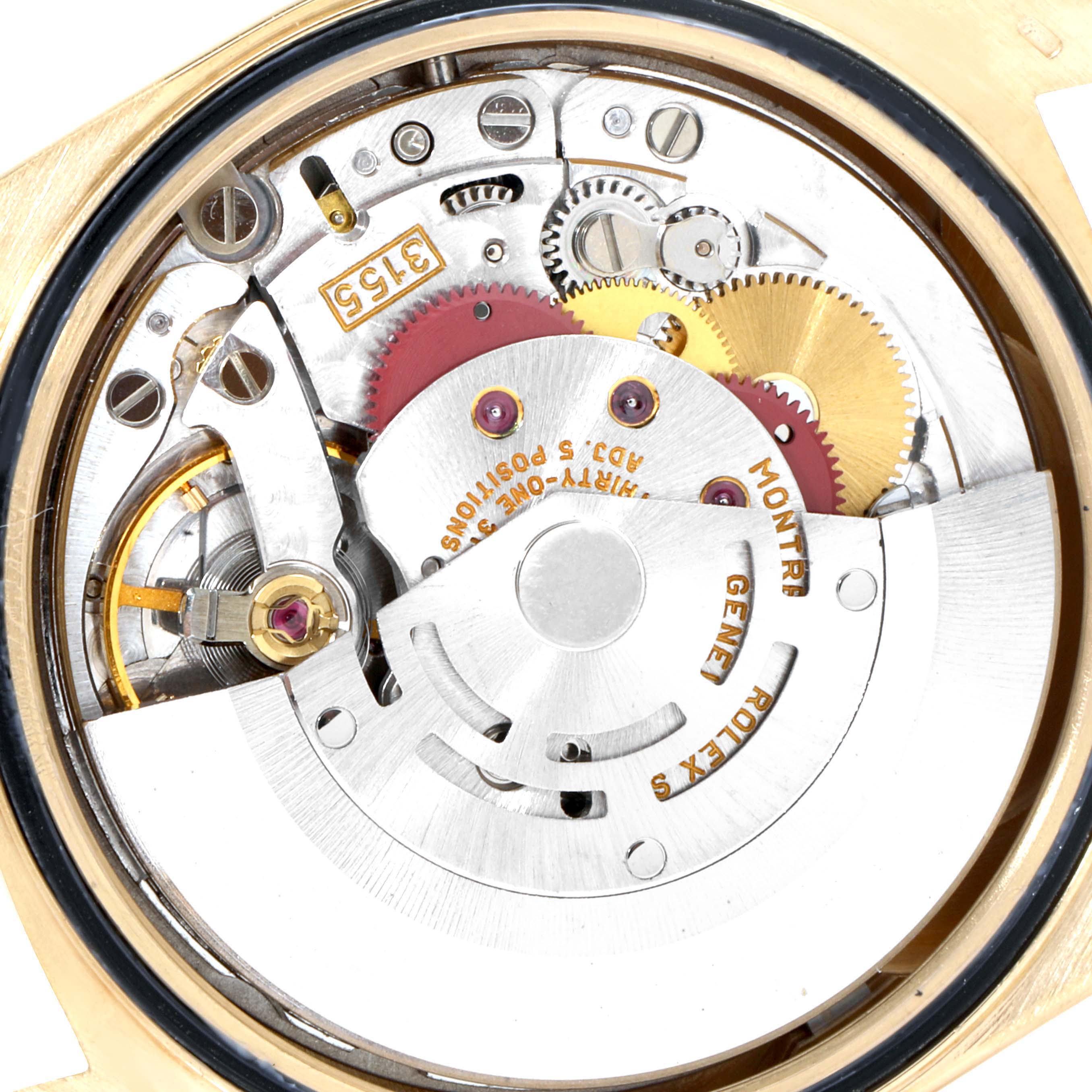 The image shows the internal mechanical movement of a Rolex President 18238 Men
s Yellow Gold Champagne Dial 18238 Men
s Yellow Gold Champagne Dial model, showcasing gears, springs, and the rotor.