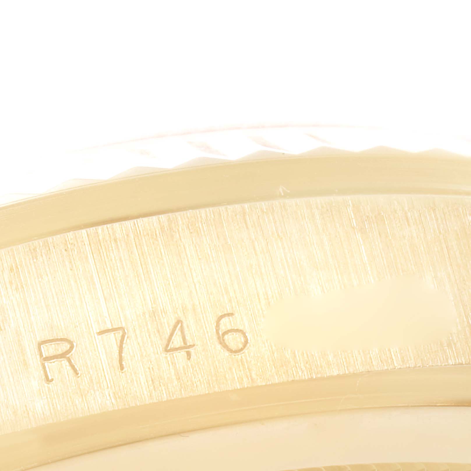 This close-up image shows the side detail and serial number engraving on a Rolex President 18238 Men
s Yellow Gold Champagne Dial 18238 Men
s Yellow Gold Champagne Dial model watch.