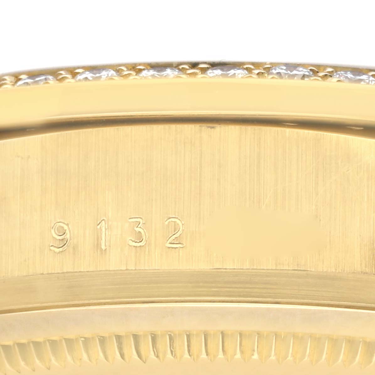 This image shows a close-up of the side case with serial numbers on the Rolex President 18048 Men's Yellow Gold Champagne Dial 18048 Men's Yellow Gold Champagne Dial watch.