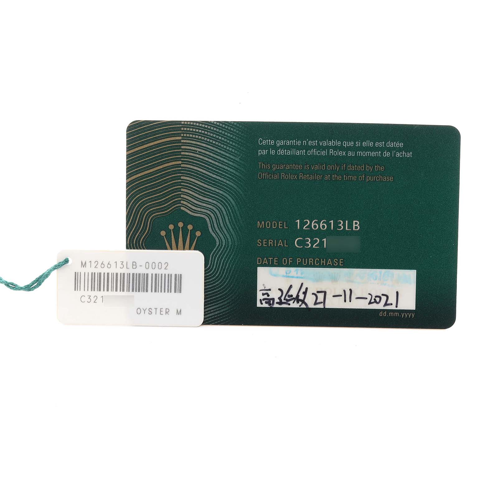 The image shows a warranty card and a label for the Rolex Submariner 126613LB Men's Steel and Gold (two tone) Blue Dial 126613LB Men's Steel and Gold (two tone) Blue Dial model, with model and serial numbers visible.