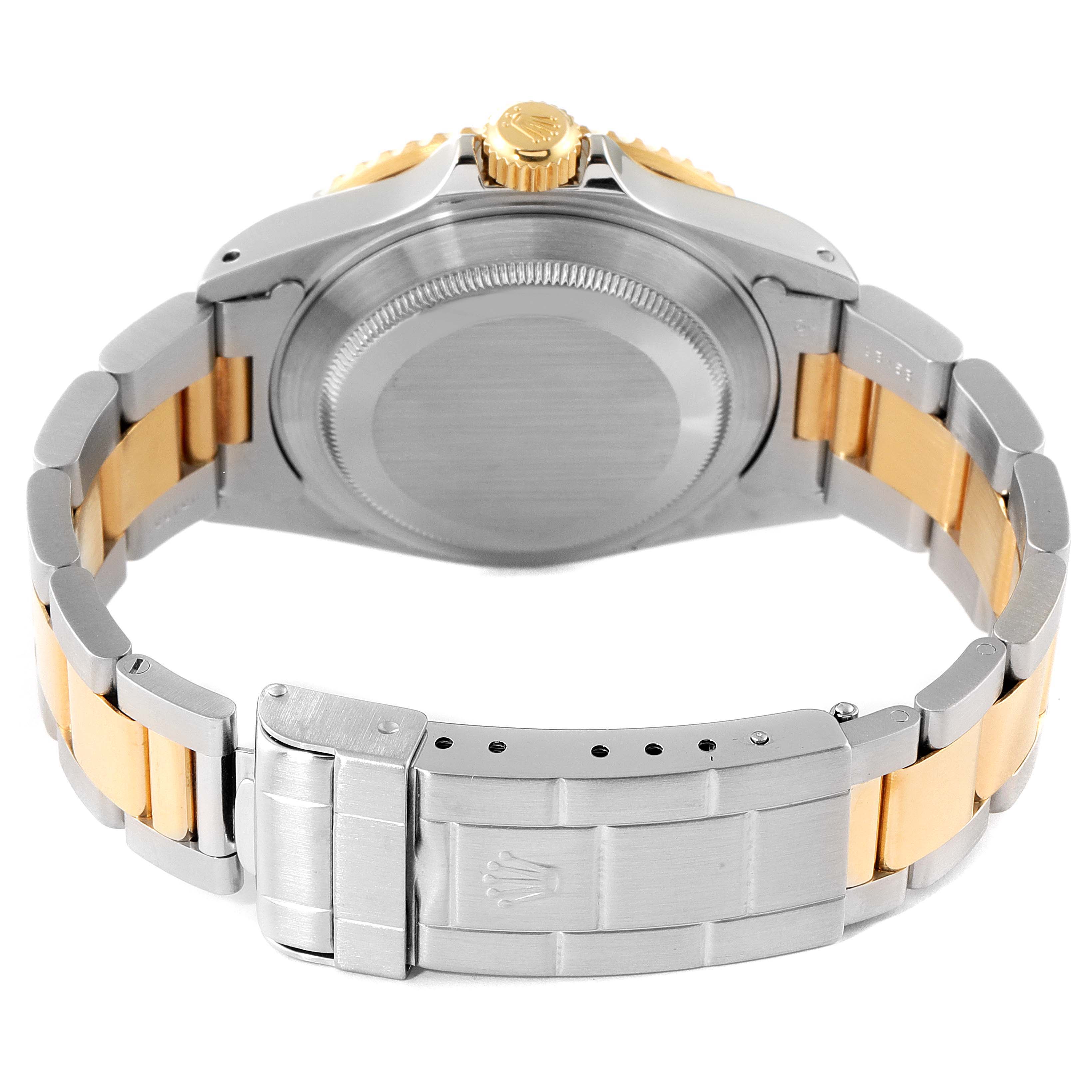 The image shows the back case and bracelet of the Rolex Submariner 16613 Men
s Steel and Gold (two tone) Blue Dial 16613 Men
s Steel and Gold (two tone) Blue Dial watch from a rear angle.