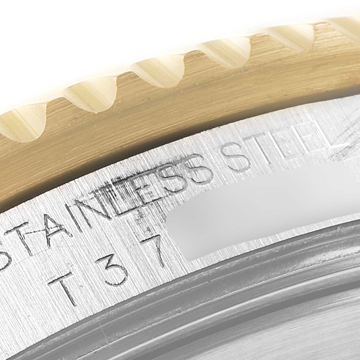 The image shows a close-up of the case and bezel, revealing "STAINLESS STEEL" text on a Rolex Submariner 16613 Men
s Steel and Gold (two tone) Blue Dial 16613 Men
s Steel and Gold (two tone) Blue Dial.