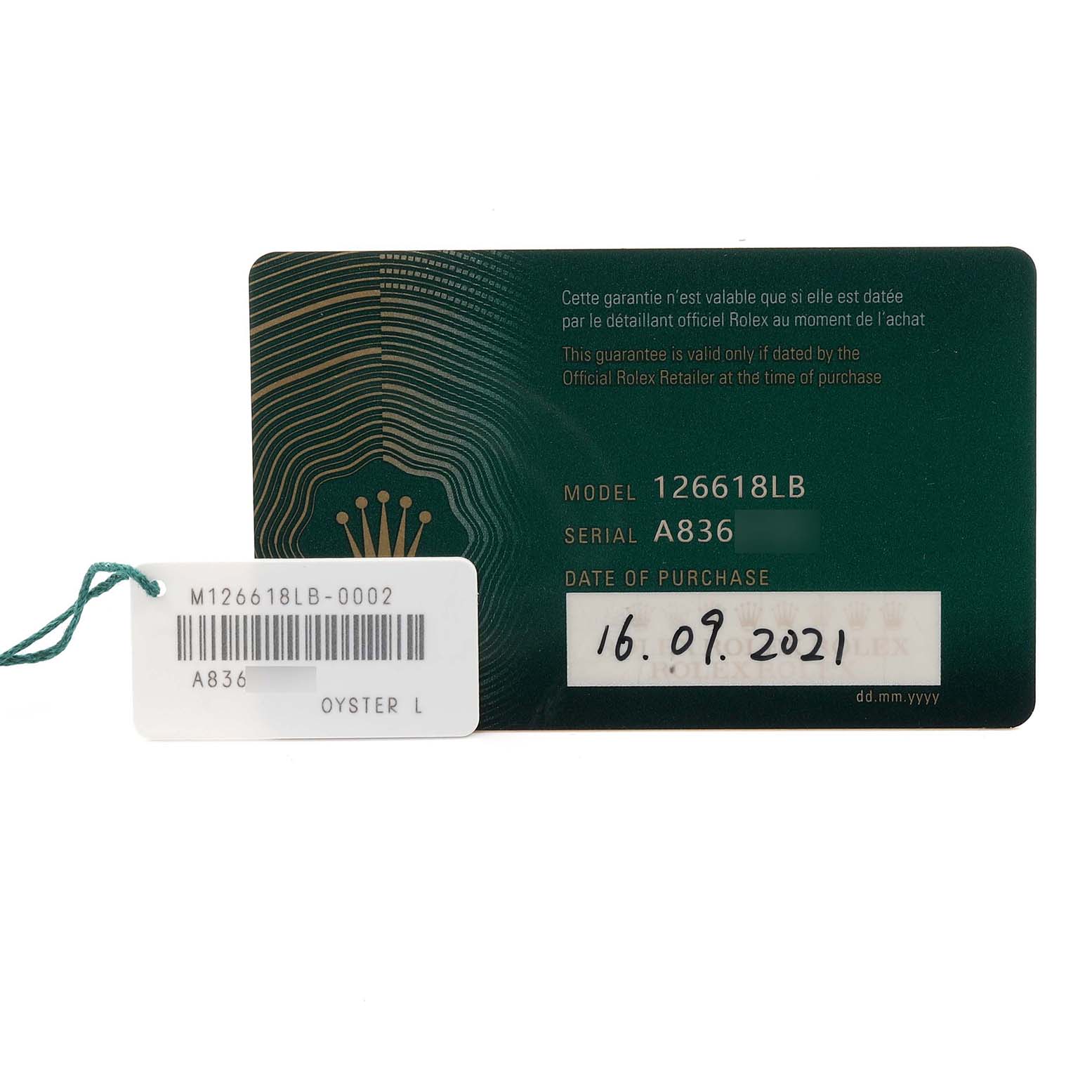 The image shows a warranty card and tag for a Rolex Submariner 126618LB Men's Yellow Gold Blue Dial 126618LB Men's Yellow Gold Blue Dial model 126618LB.